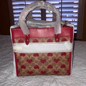 Brand new with original packaging  Authentic Coach Heart Tote “22..
